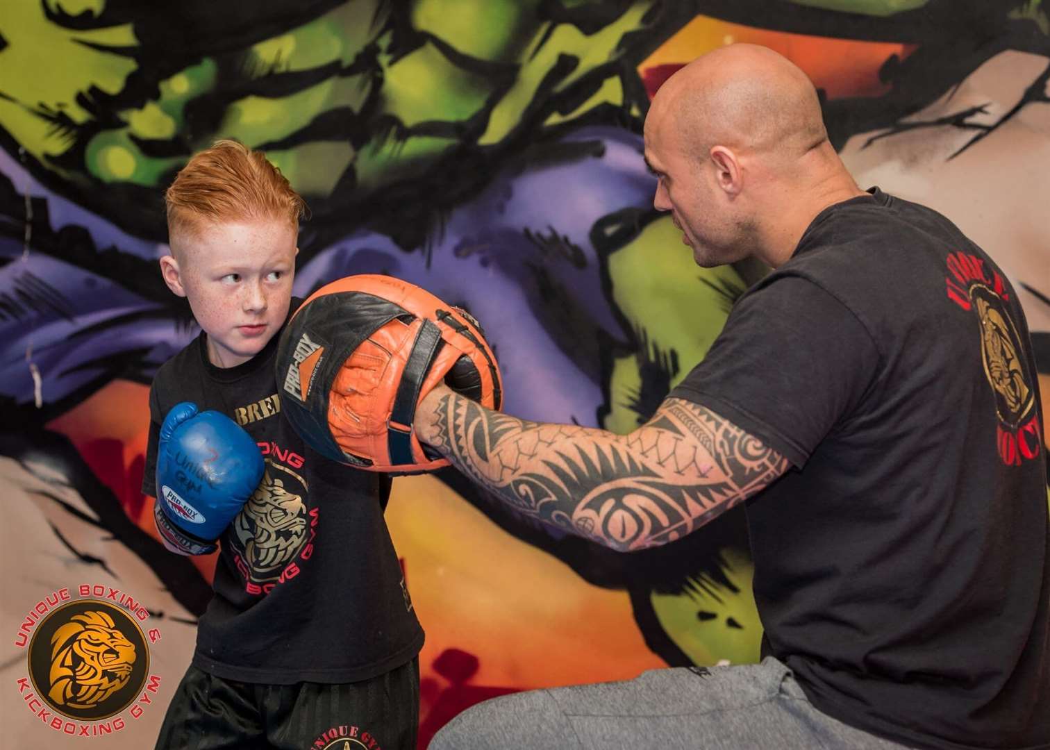 Matt Simms practising with a youngster at the gym