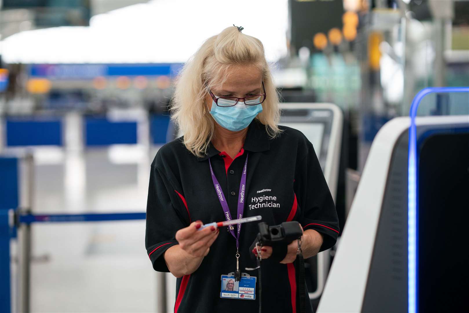 A hygiene technician at the aiport (Heathrow Airport/PA)