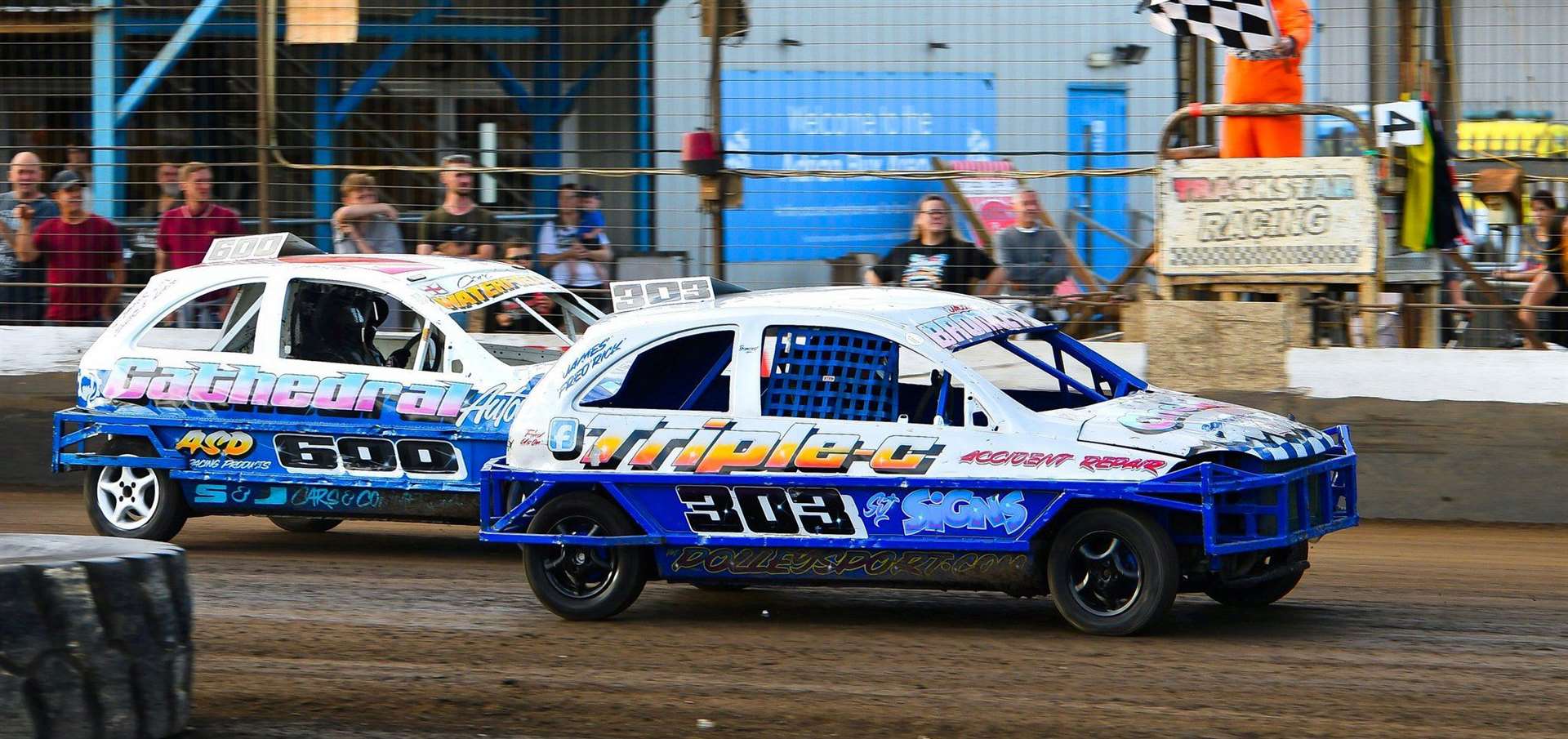 Jacob Bromley takes the chequered flag by less than a car length from Carl Waterfield. Picture: Jim Harrod