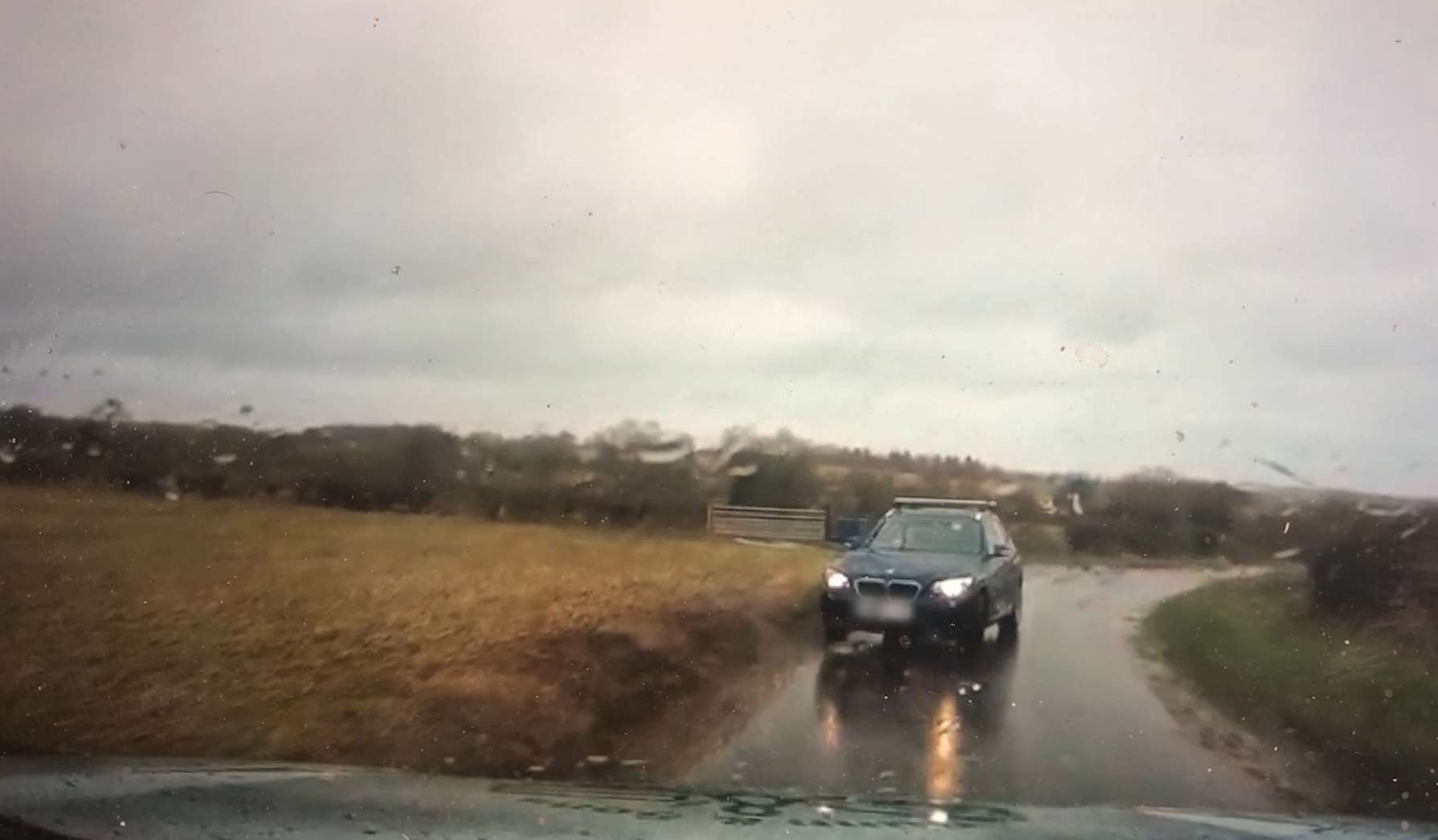 Dashcam footage showed a blue BMW on the wrong side of the road near RAF Croughton in January (PA)