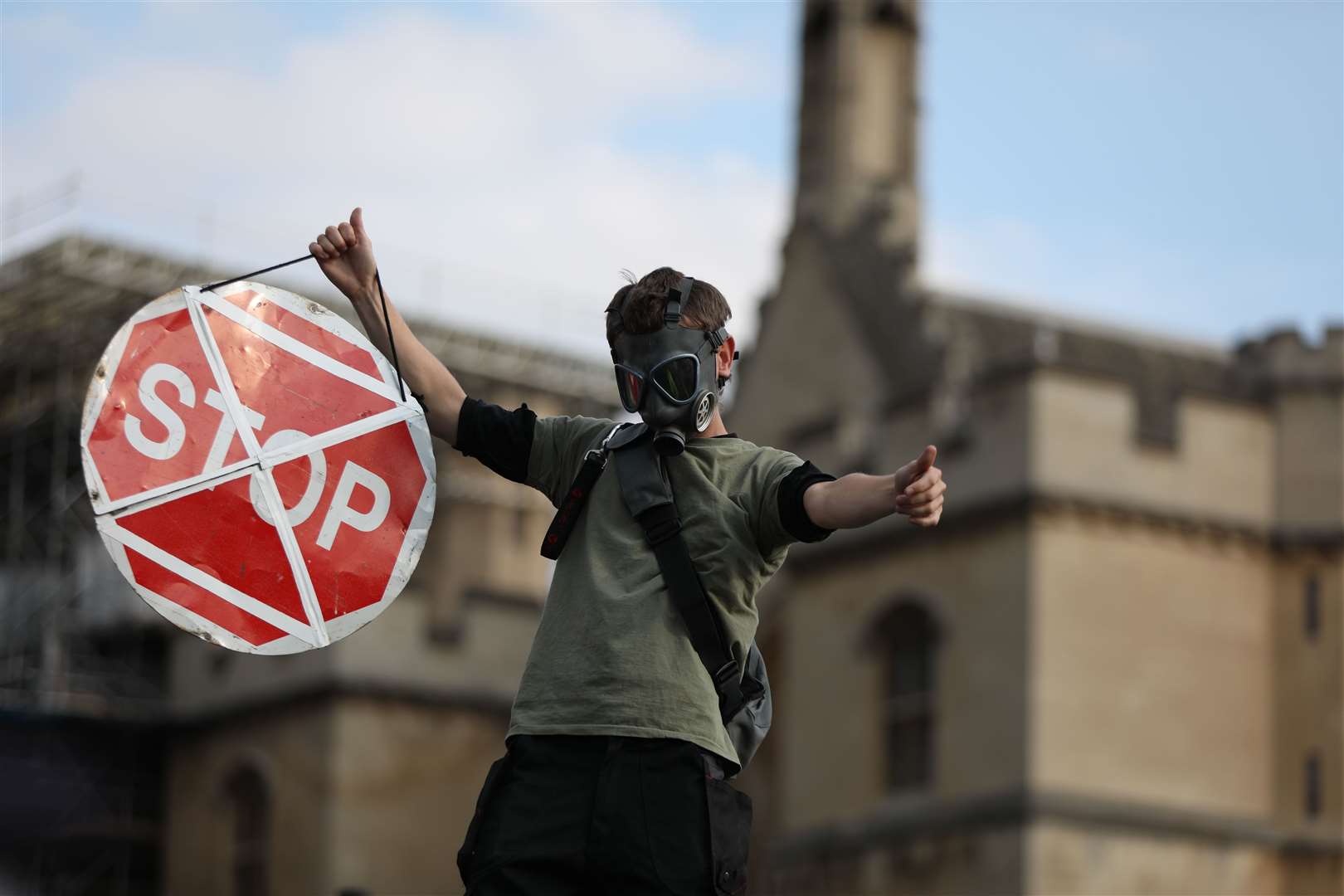 A protester standing on the roof of a car in Parliament Square (Luciana Guerra/PA)