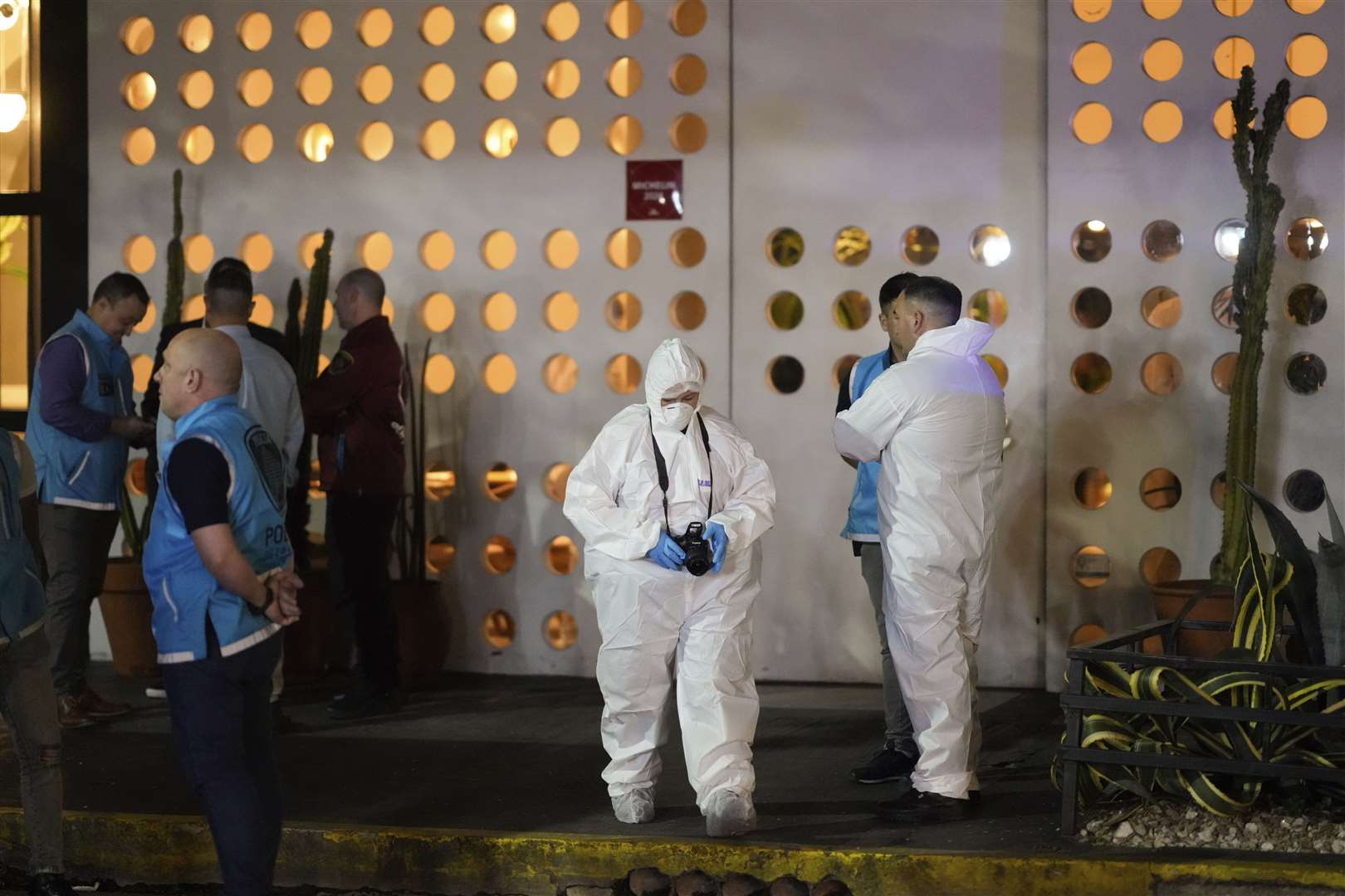 Forensic investigators leave the hotel in Buenos Aires, Argentina, where former One Direction singer Liam Payne was found dead (Natacha Pisarenko/AP)