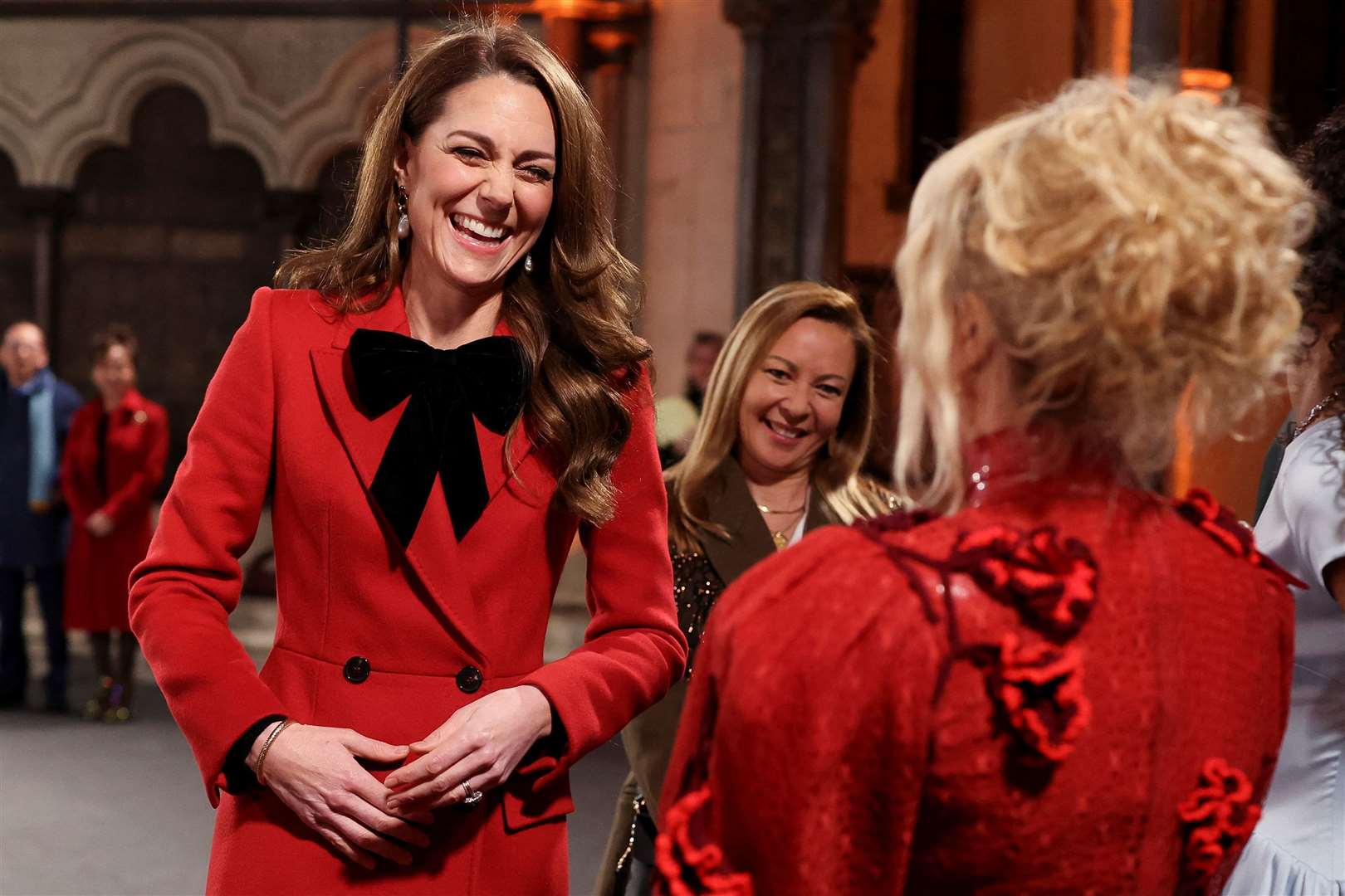 The Princess of Wales laughs with Paloma Faith at Kate’s Together At Christmas carol service in Westminster Abbey in December (Isabel Infantes/PA)