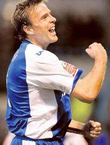 Mark Bentley punches the air with delight after hitting Gillingham's third goal