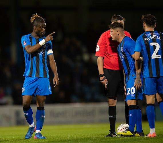 Darren Oldaker receves some advice from captain Gabriel Zakuani before Gills' last chance of the game. Oldaker put the free-kick well wide. Picture: Ady Kerry