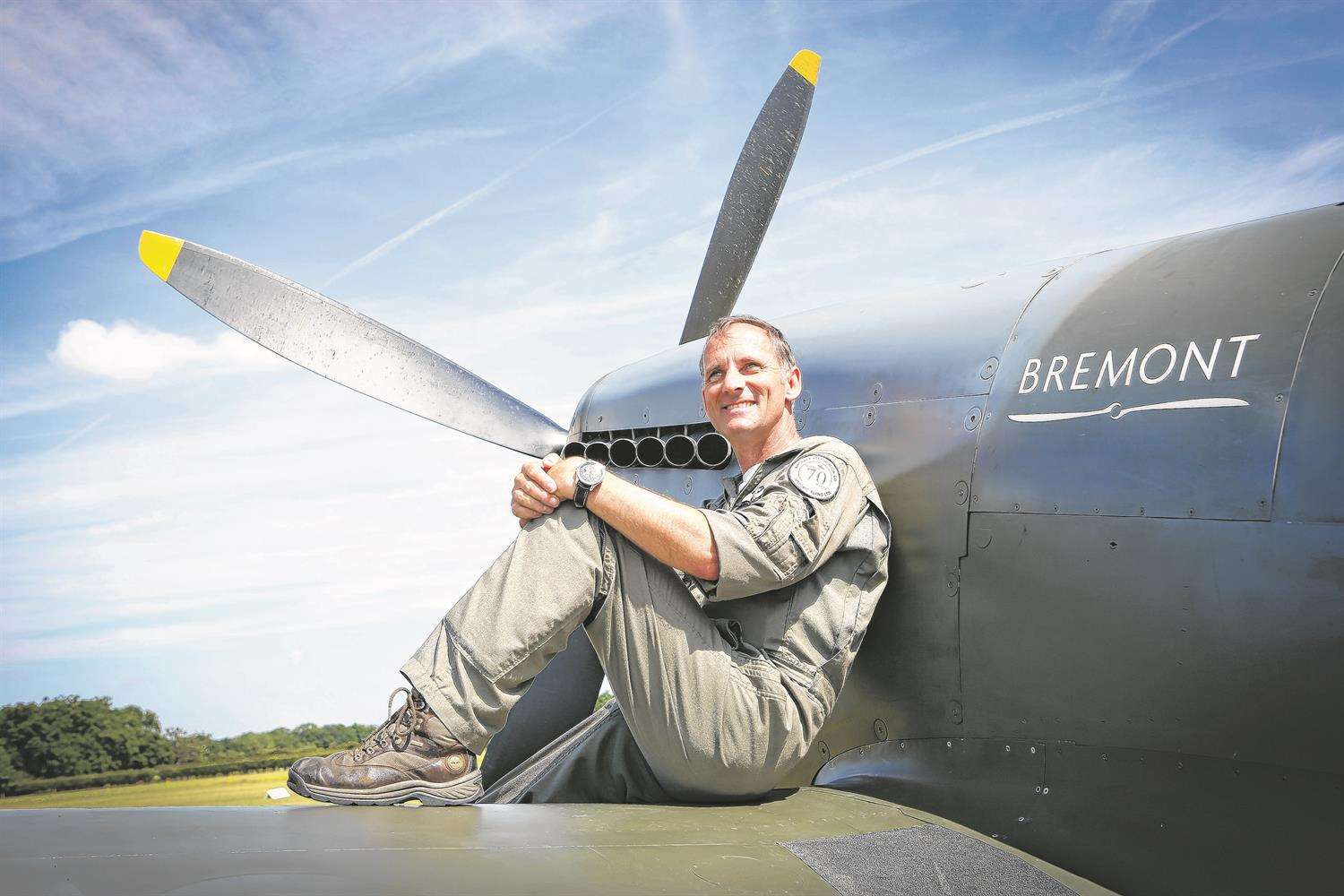 Pilot David 'Rats' Ratcliffe on the wing of a Spitfire Tr9.