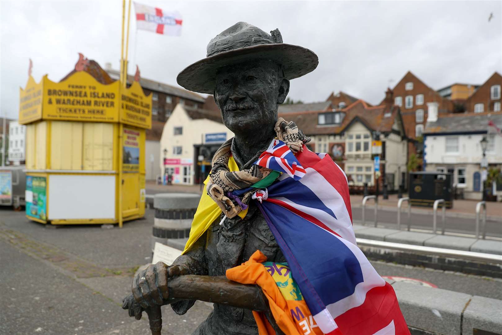 The statue of Robert Baden-Powell on the quay at Poole, Dorset, after the local council removed the protective hoarding around it which was erected last month following concerns for its safety after Black Lives Matter protesters in Bristol pulled down a statue of slave trader Edward Colston. (Andrew Matthews/PA)