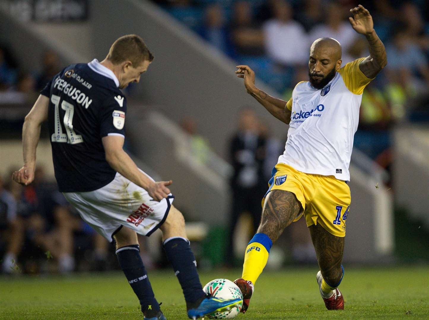 Josh Parker challenges Millwall's Shane Ferguson Picture: Ady Kerry