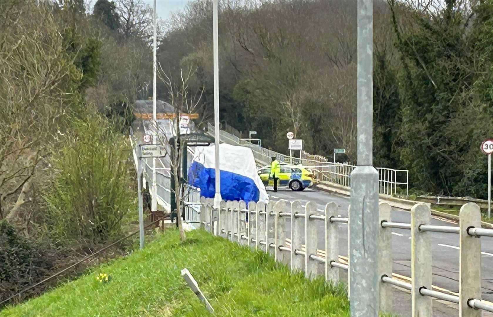 A white tent erected near a bus stop in Boughton-under-Blean after Adam Pritchard was killed