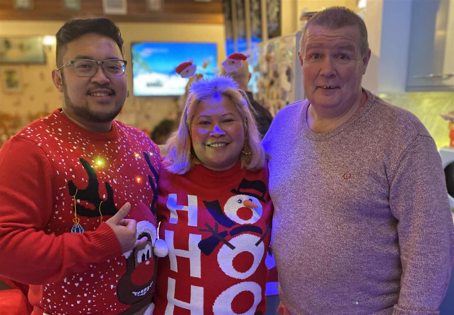 Healthcare assistant Adela Baldwin-White, 47, with her son Eric Plando (left) and husband Lawrence Baldwin-White. (Family handout/PA)