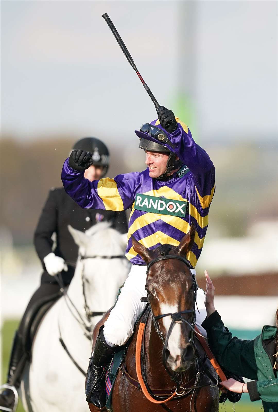 Derek Fox celebrates on Corach Rambler after winning the Randox Grand National Handicap Chase (Mike Egerton/PA)