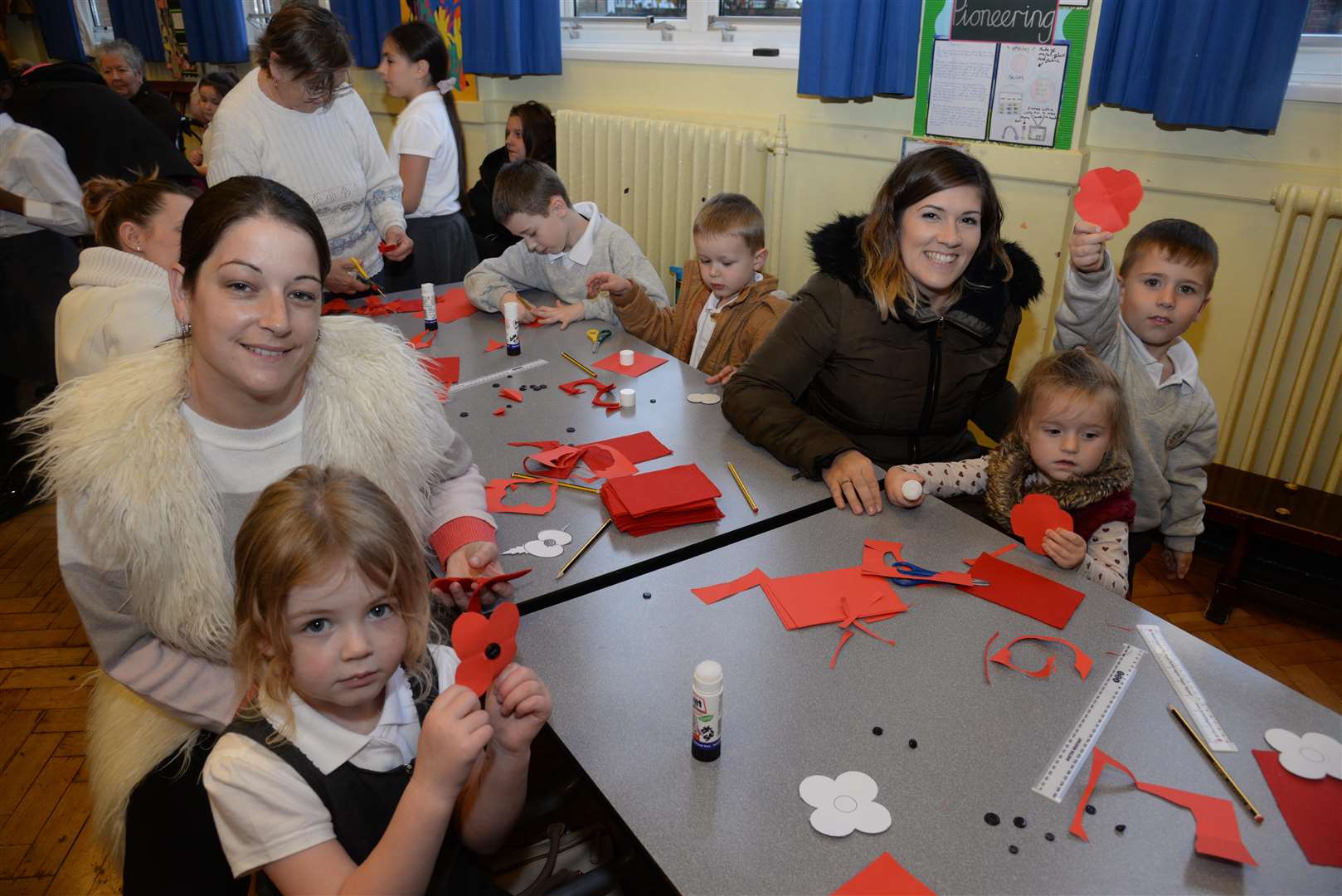 Children and parents at the Remembrance poppy making session at Oaks Primary Academy in Maidstone on Wednesday. Picture: Chris Davey... (5286110)