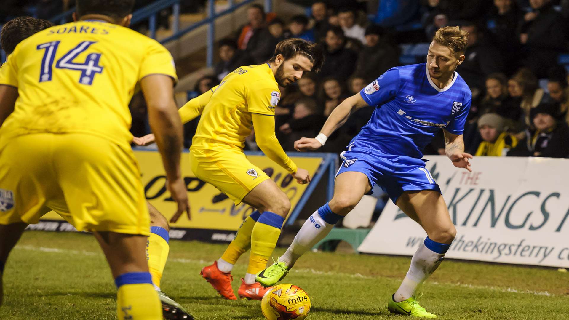 Lee Martin takes on two Dons rivals Picture: Andy Payton