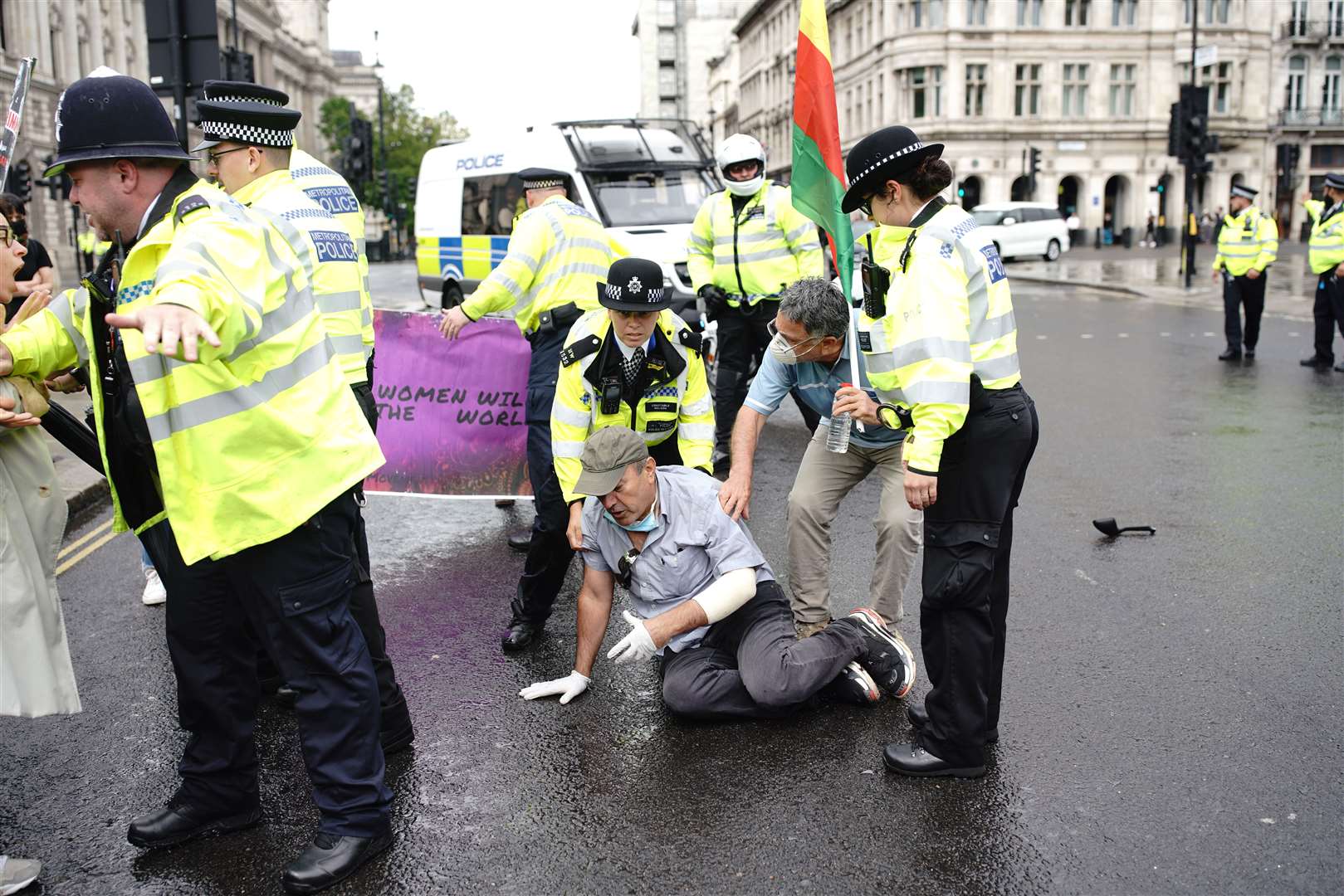 Police detain a man after he ran in front of Prime Minister Boris Johnson’s car (Aaron Chown/PA)