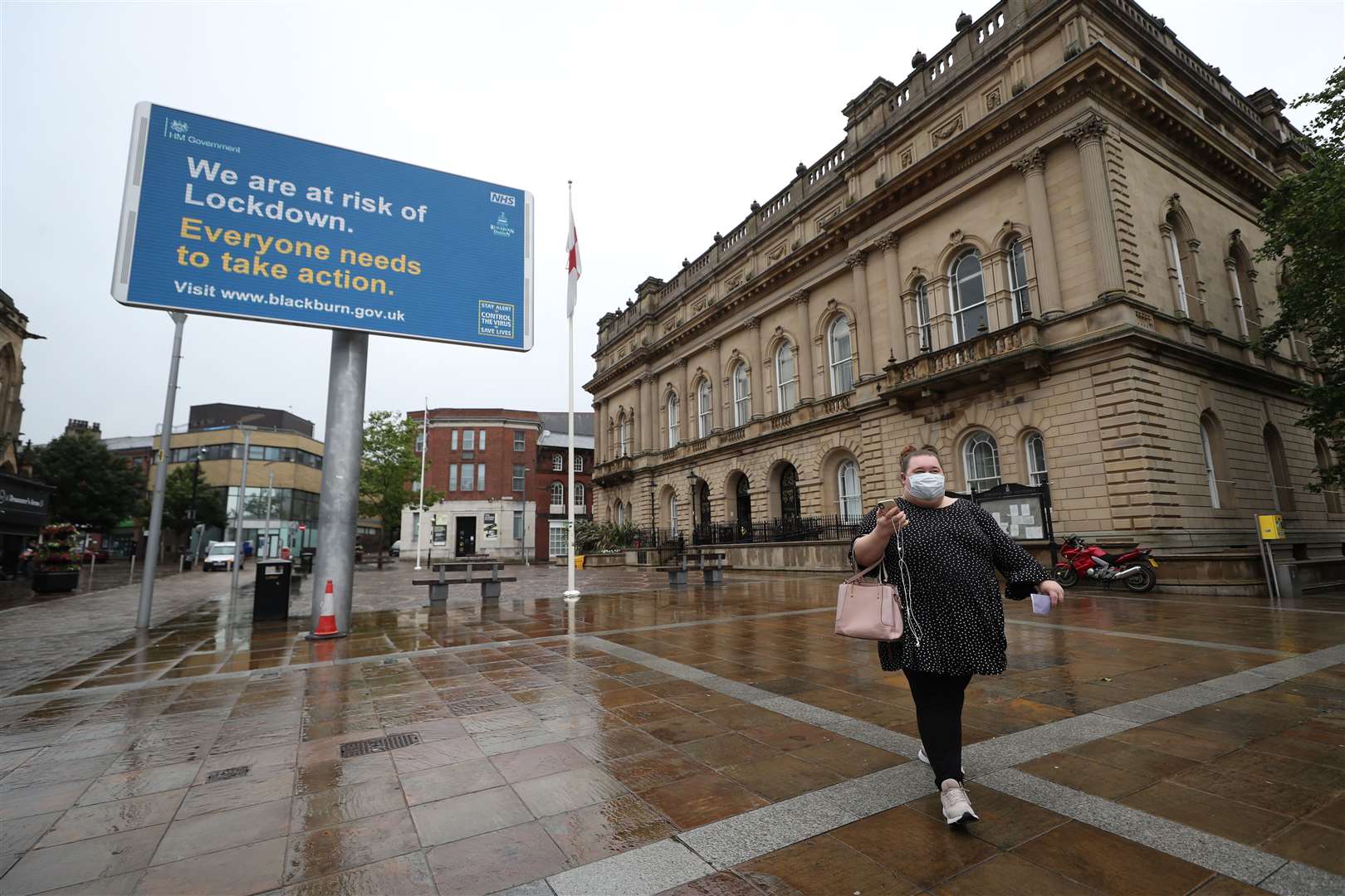 Coronavirus advice on a billboard outside Blackburn Town Hall (Peter Byrne/PA)