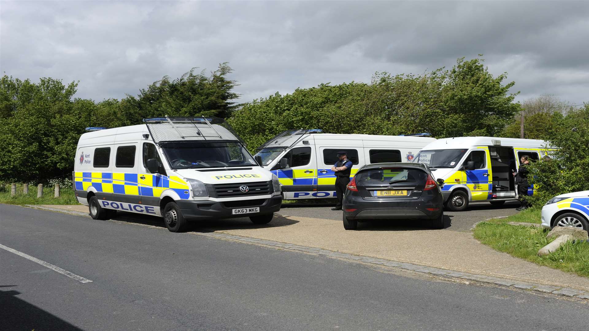 Police activity at the caravan site following the shooting