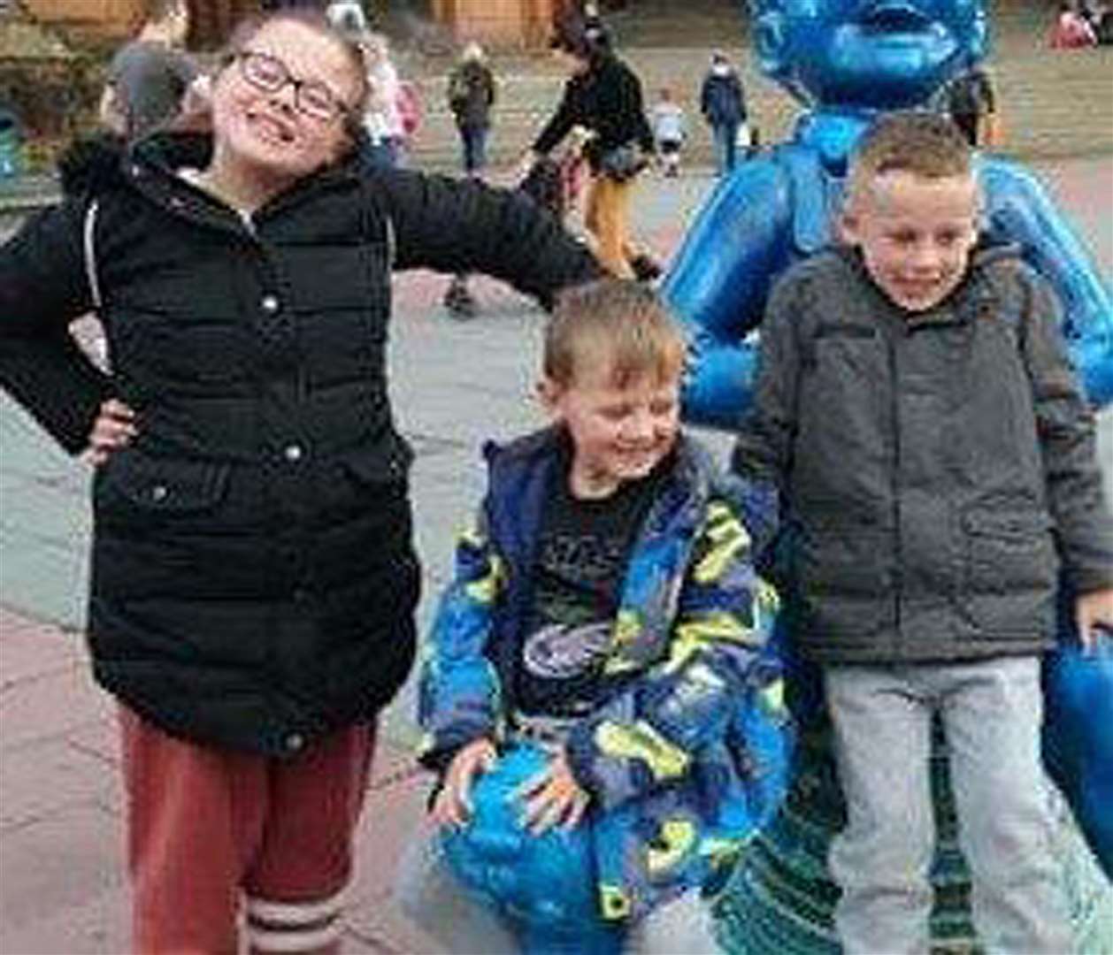 Fiona Gibson with brothers Alexander James and Philip, who died in hospital after the fire (Police Scotland/PA)