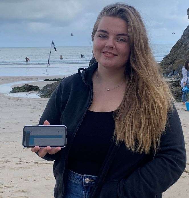 Sittingbourne School A-level pupil Taya Johnson getting her results online while holidaying in Cornwall
