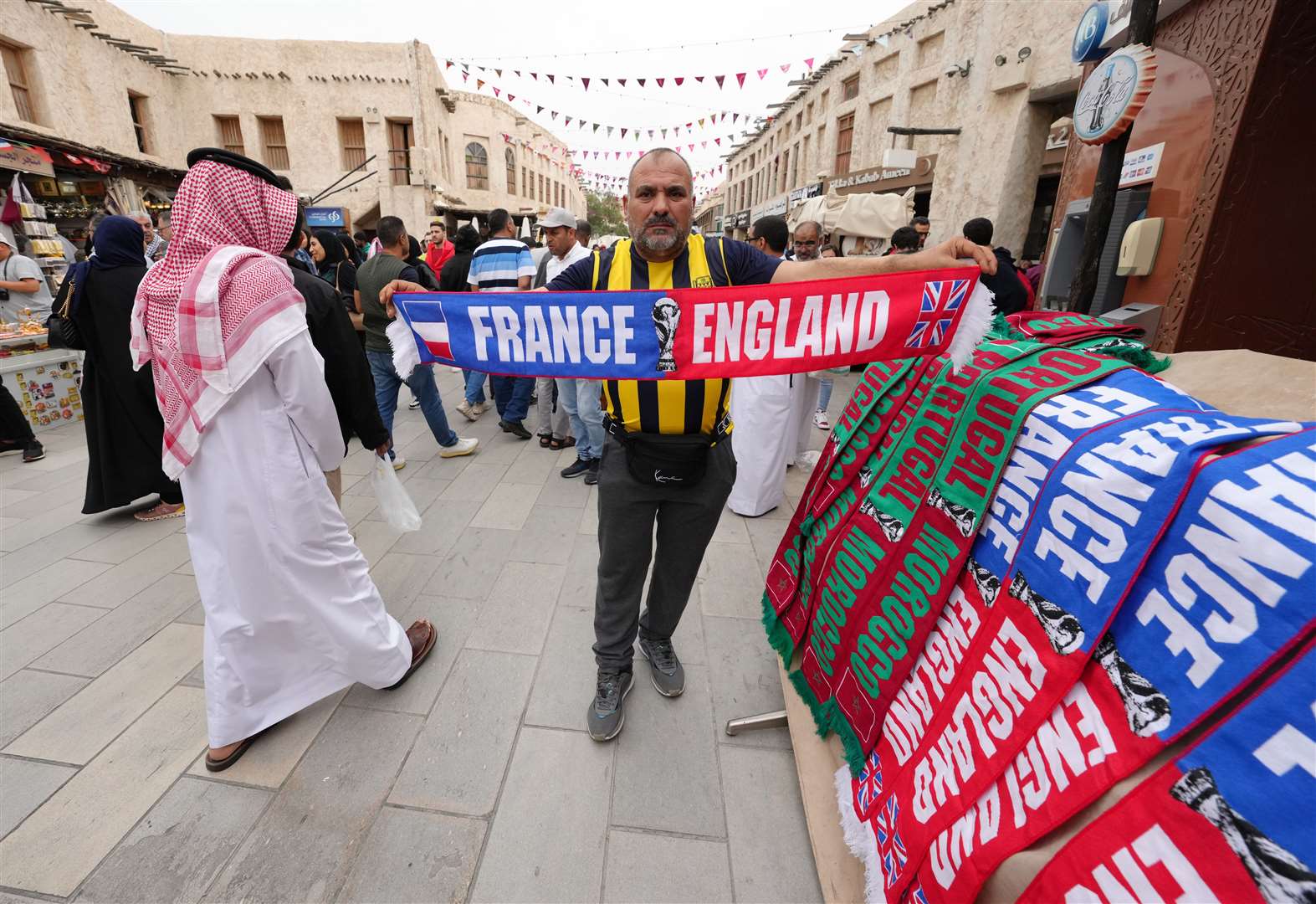 Half and half scarfs are sold in Souq Waqif before the England v France match at the Al Bayt Stadium in Al Khor, Qatar (Nick Potts/PA)