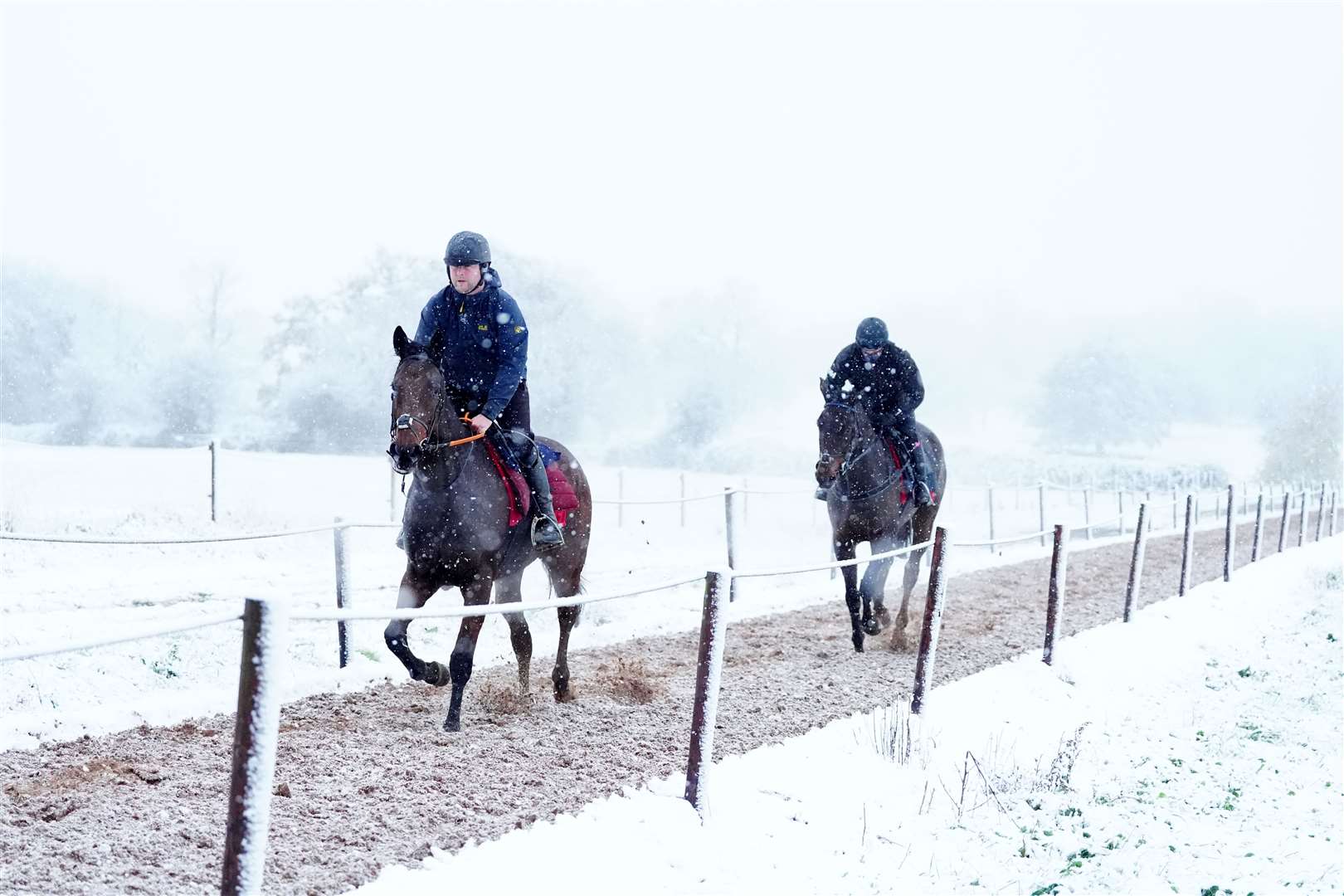 Horses are exercised on the gallops at Sam Drinkwater’s Granary Stables, Strensham, Worcestershire (David Davies/PA)