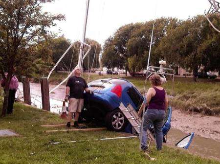 Cindy Parker's runaway Peugeot dangles over Faversham Creek