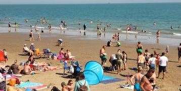 Beachgoers swimming in the sea - unaware of the sewage leak. Picture: Louise O'Connell