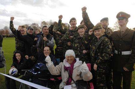 Spectators watch the action during the charity football match in aid of the Princess of Wales Royal Regiment held at the Abbey School, Faversham