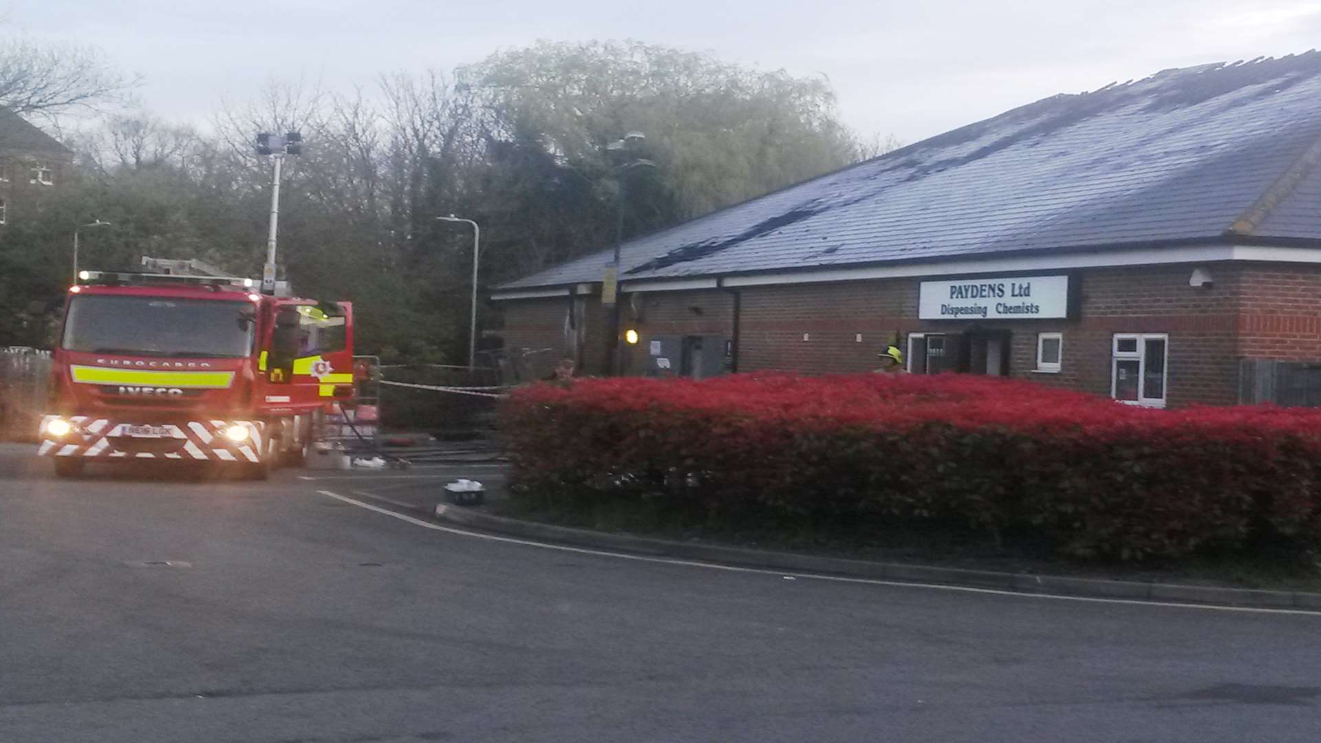 A fire engine at the rear of the fire-damaged Tesco Express in Mace Lane, Ashford