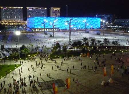 A scene from outside the Bird's Nest stadium in Bejing with the swimming bubble in the background