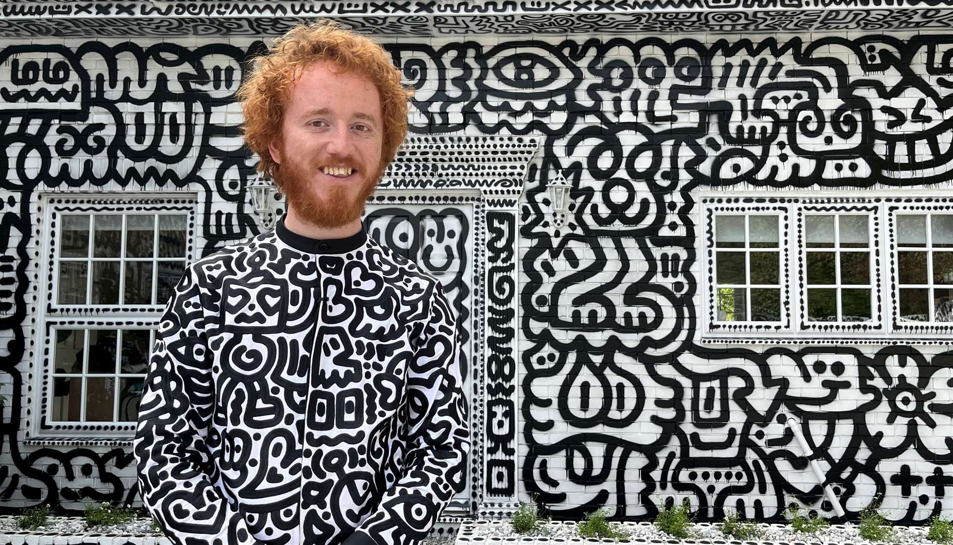 Mr Doodle outside his doodled home in St Michaels, near Tenterden