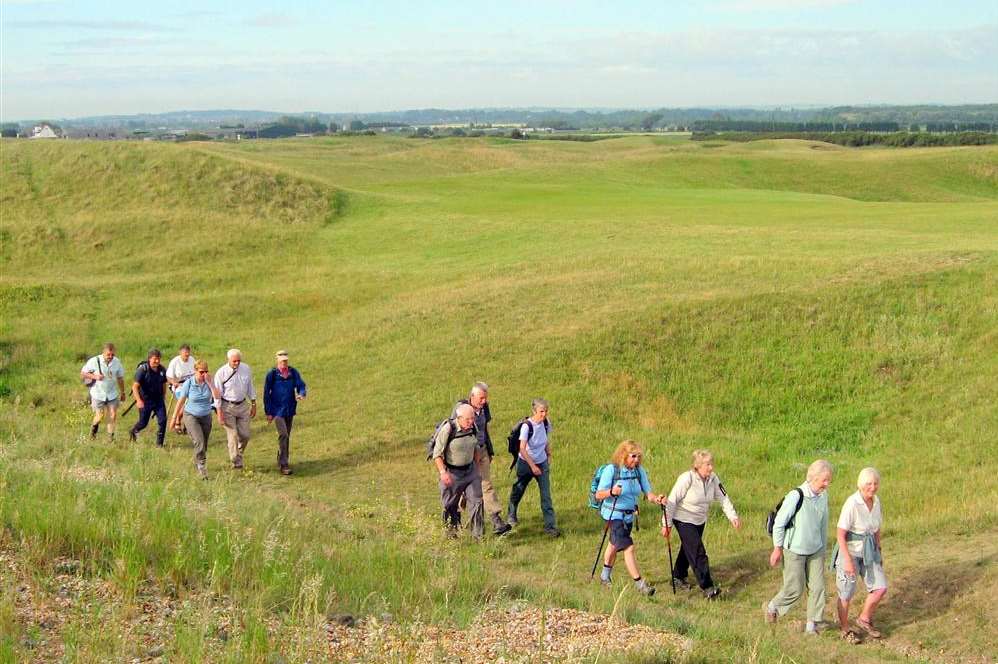 Walkers near a golf course in Deal