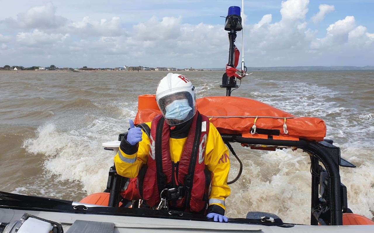 Volunteer crew member Sarah Munnings holding onto the dinghy. Picture: Peter Leigh