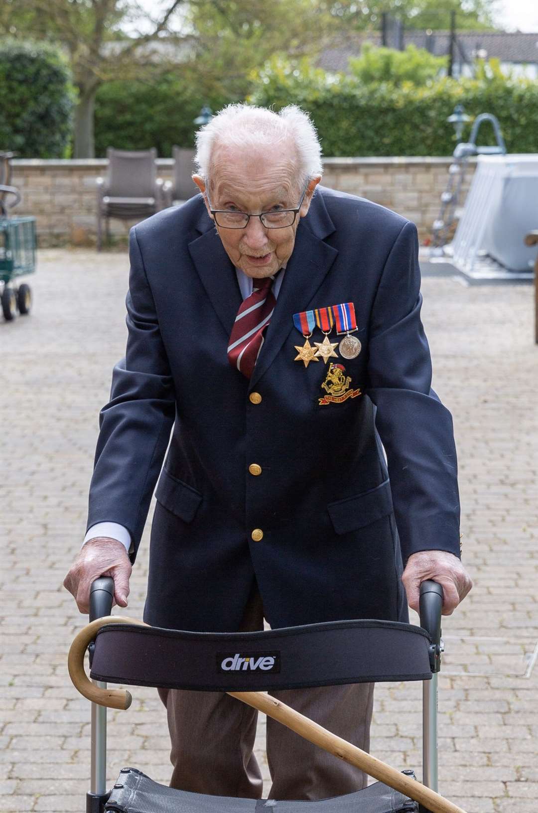 Military veteran Tom Moore has raised £10 million for the NHS walking lengths of his garden (Tom Moore/PA)