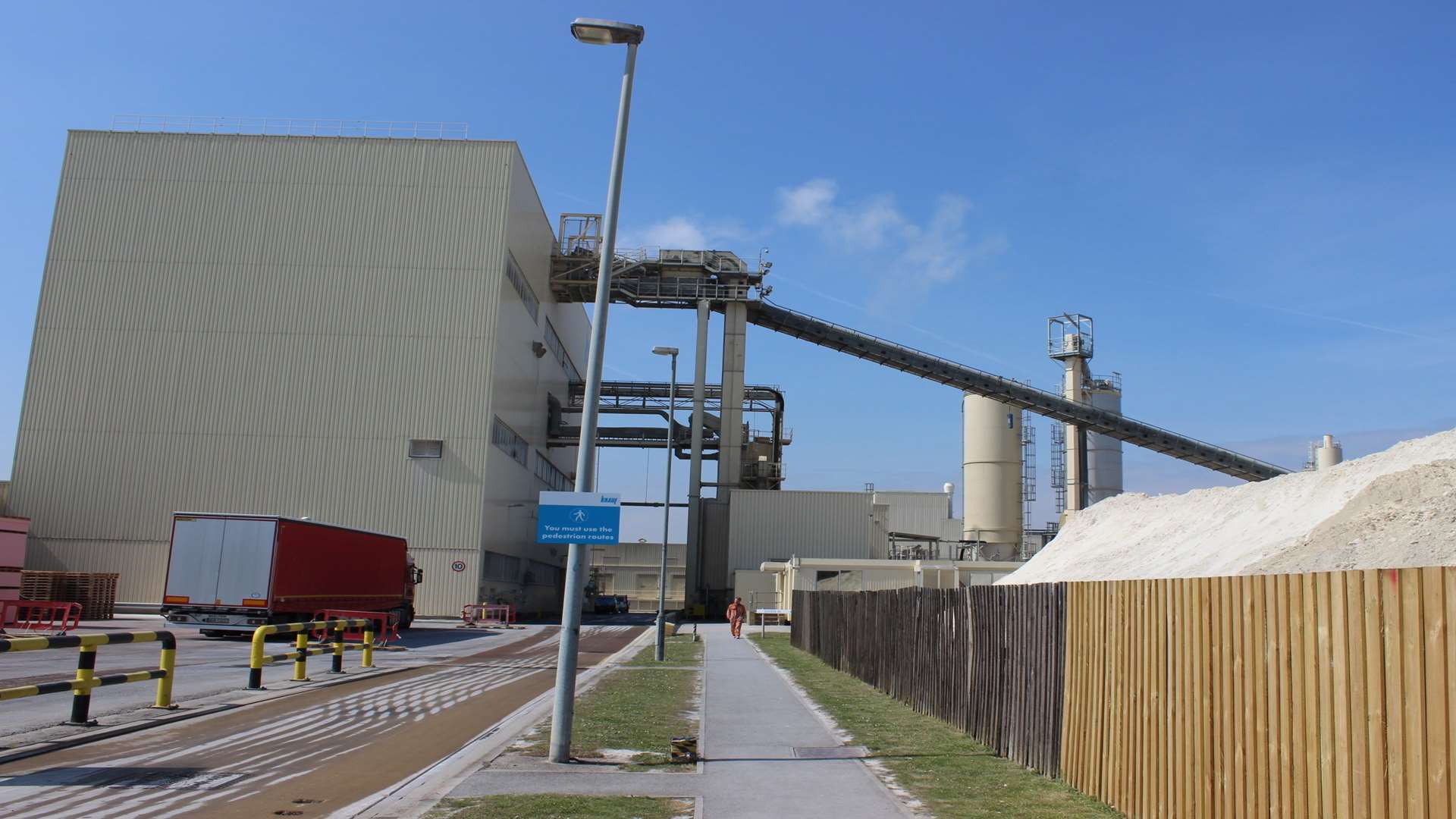 Outside the Knauf factory at Ridham Dock, with stockpiles of gypsum on the right