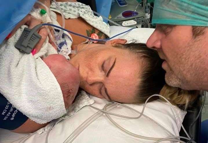 The newborn baby in Karen Mannering's arms, accompanied by dad Steve