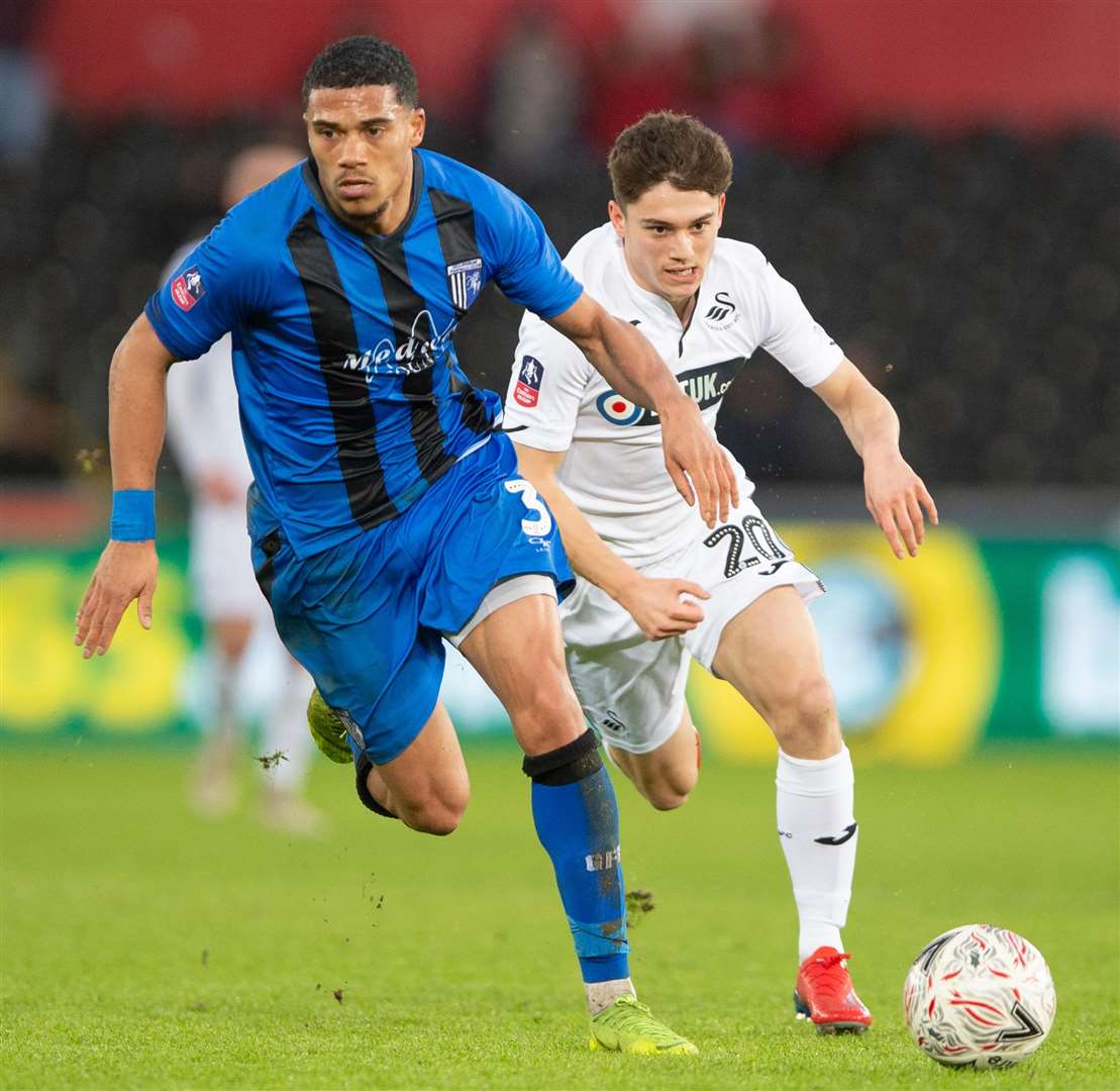 Bradley Garmston looks to get to the ball ahead of Swans' Daniel James Picture: Ady Kerry