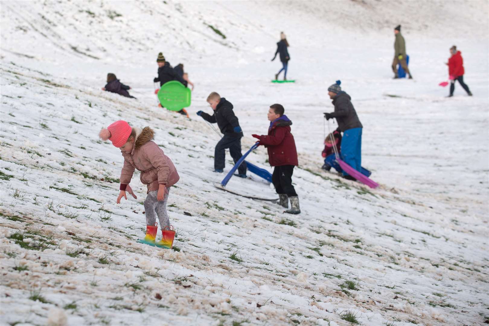 People sledging in the snow in a park in Newcastle-under-Lyme, Staffordshire (Joe Giddens/PA)