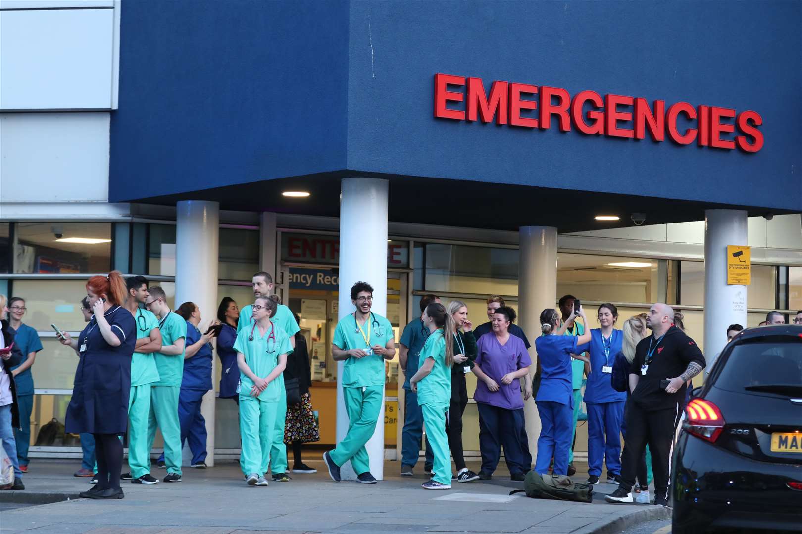 Staff from the Royal Liverpool University Hospital join in the national applause (Peter Byrne/PA)