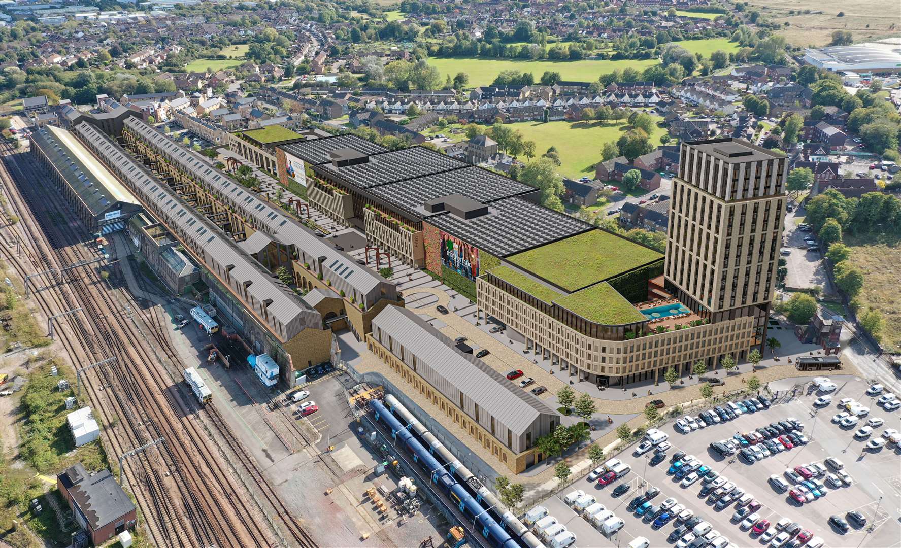 An aerial view of the new film studio complex, including 7,440 sq m of studios, supporting workshop and commercial floorspace, production offices and a media village. Developers are also planning a gym, cafe and a 120-bedroom hotel over 18 storeys, which is shown at the right of this image next to the old clock tower off Newtown Road. The clock tower entrance - which will feature traffic lights - will form one of three access points to the site. The green structure to the left of the hotel is the 336-space five-storey car park, which will include 35 disabled spaces