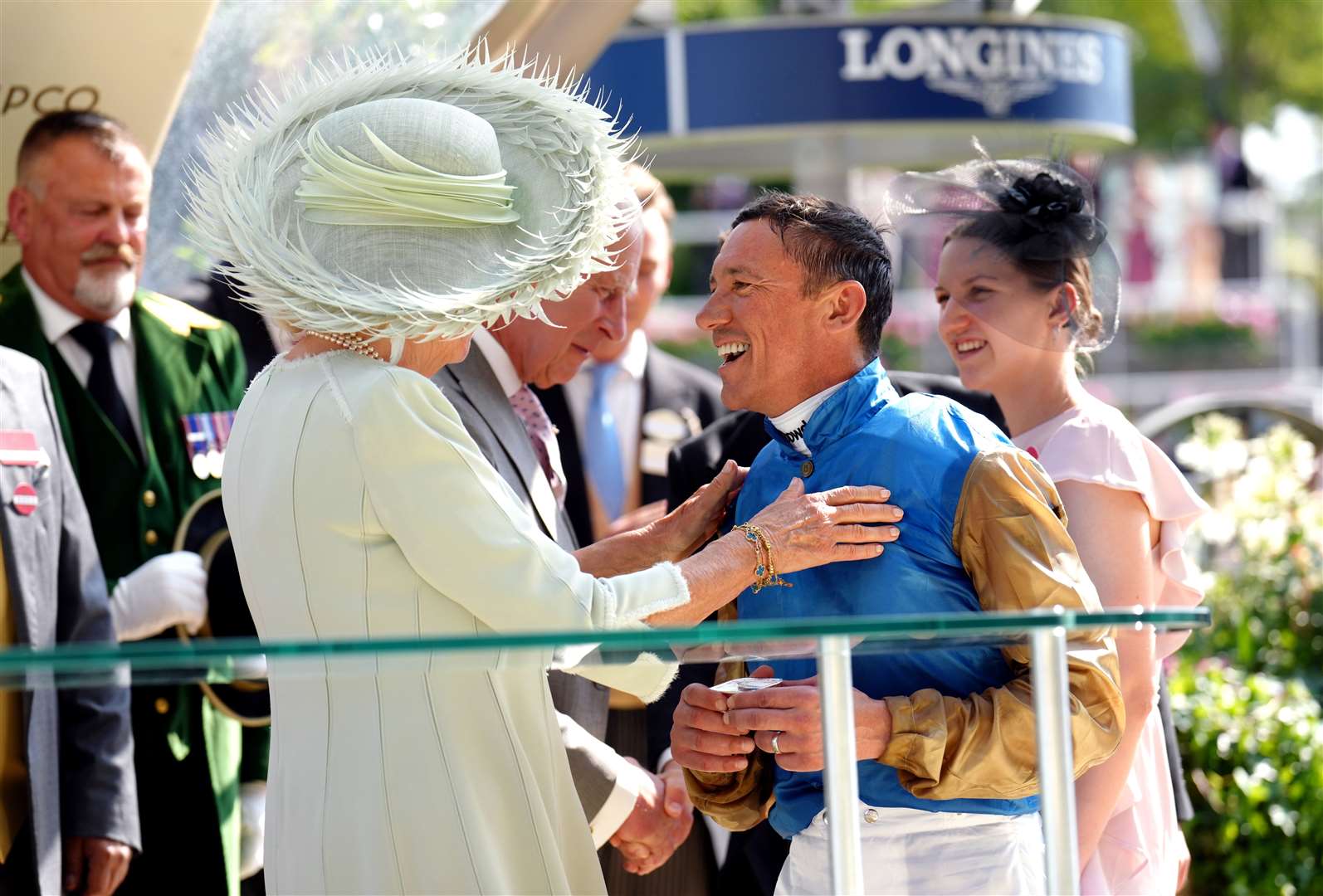 Gold Cup winning jockey Frankie Dettori shares a joke with Queen and King. John Walton/PA