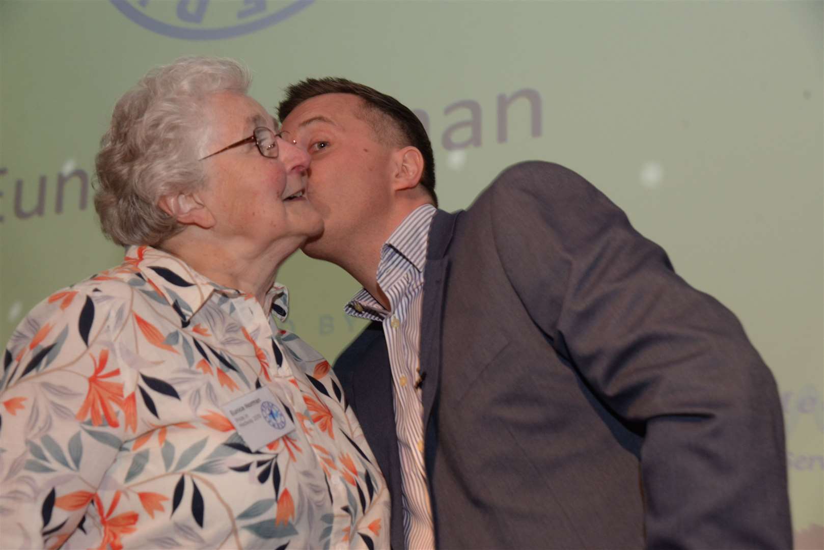 Eunice Norman gets a kiss from Mister Maker Phil Gallagher at last year's awards evening