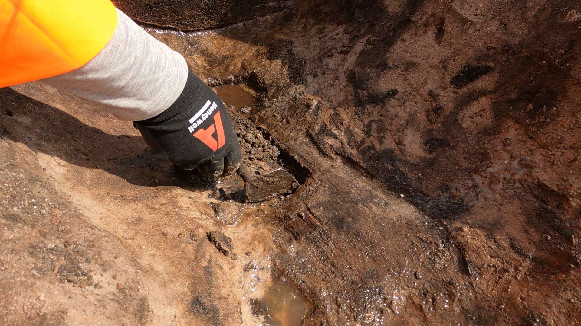 The wooden spade was carefully excavated by Wessex Archaeology experts working on The Moors at Arne project (Wessex Archaeology/PA)