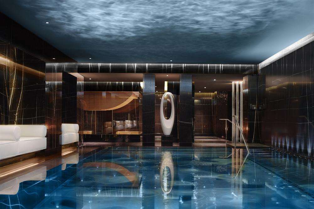 The subterranean pool looking towards the amphitheatre-style sauna at Corinthia Hotel, London.