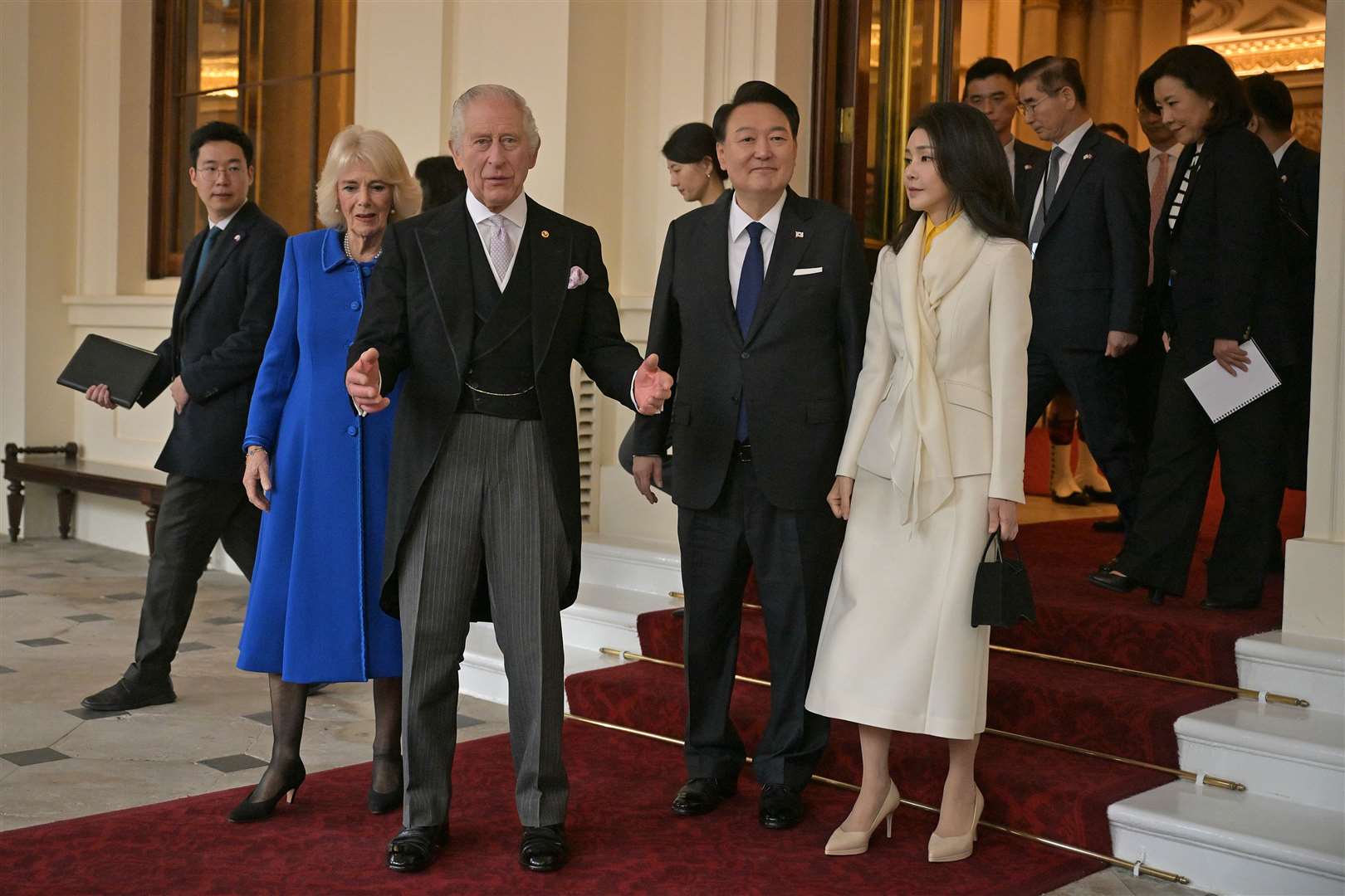 The royal couple and their guests pose for photographs at the Grand Entrance (Ben Stansall/PA)