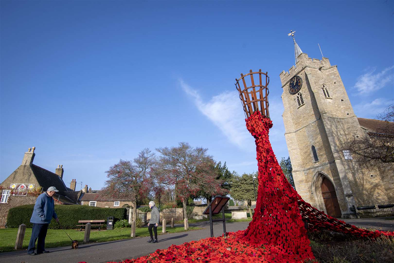 Knitted poppies outside a church in Chatteris, Cambridgeshire, to mark Remembrance Day (Joe Giddens/PA)