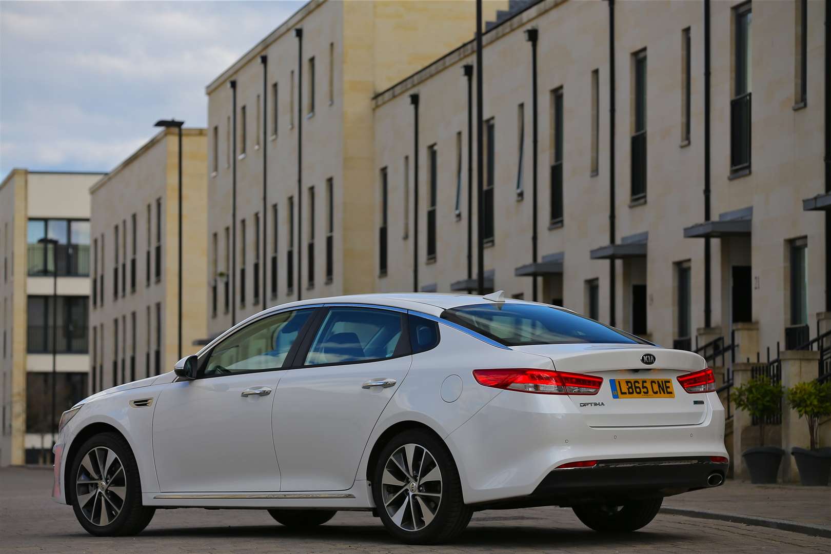 At the rear the boot rises, spoiler-like, while the expansive bumper flows into a diffuser section where the chrome-tipped exhaust emerges