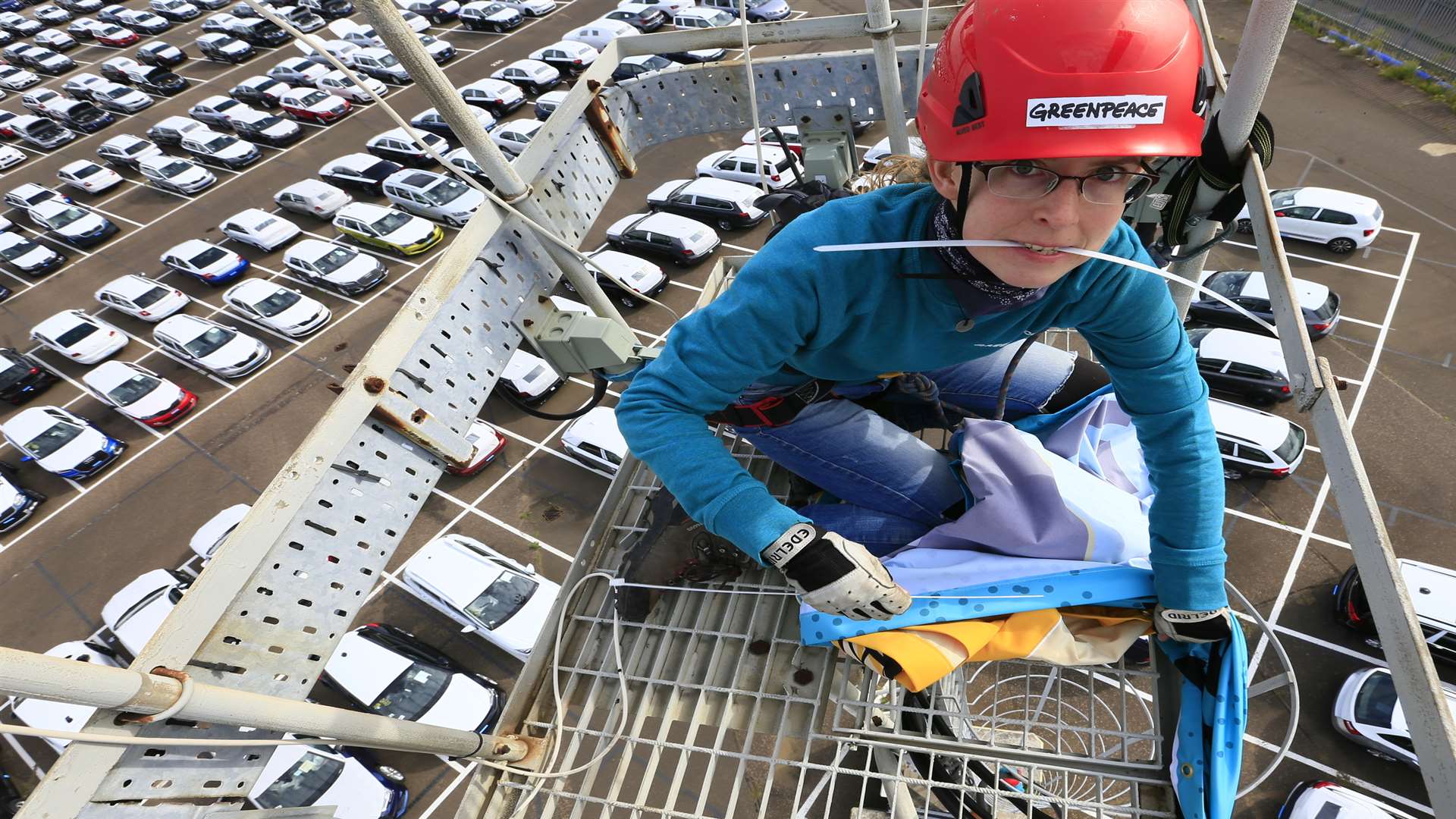 Campaigners hung banners from lighting gantries in the docks. Picture: Jiri Rezac/Greenpeace