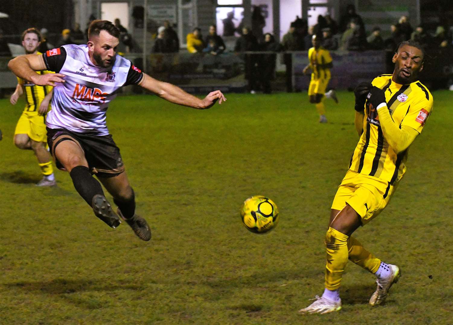 Veteran Deal defender Josh Vincent clears against Sheppey scorer Gil Carvalho in the Hoops’ 3-1 Isthmian South East win on Saturday. Picture: Marc Richards