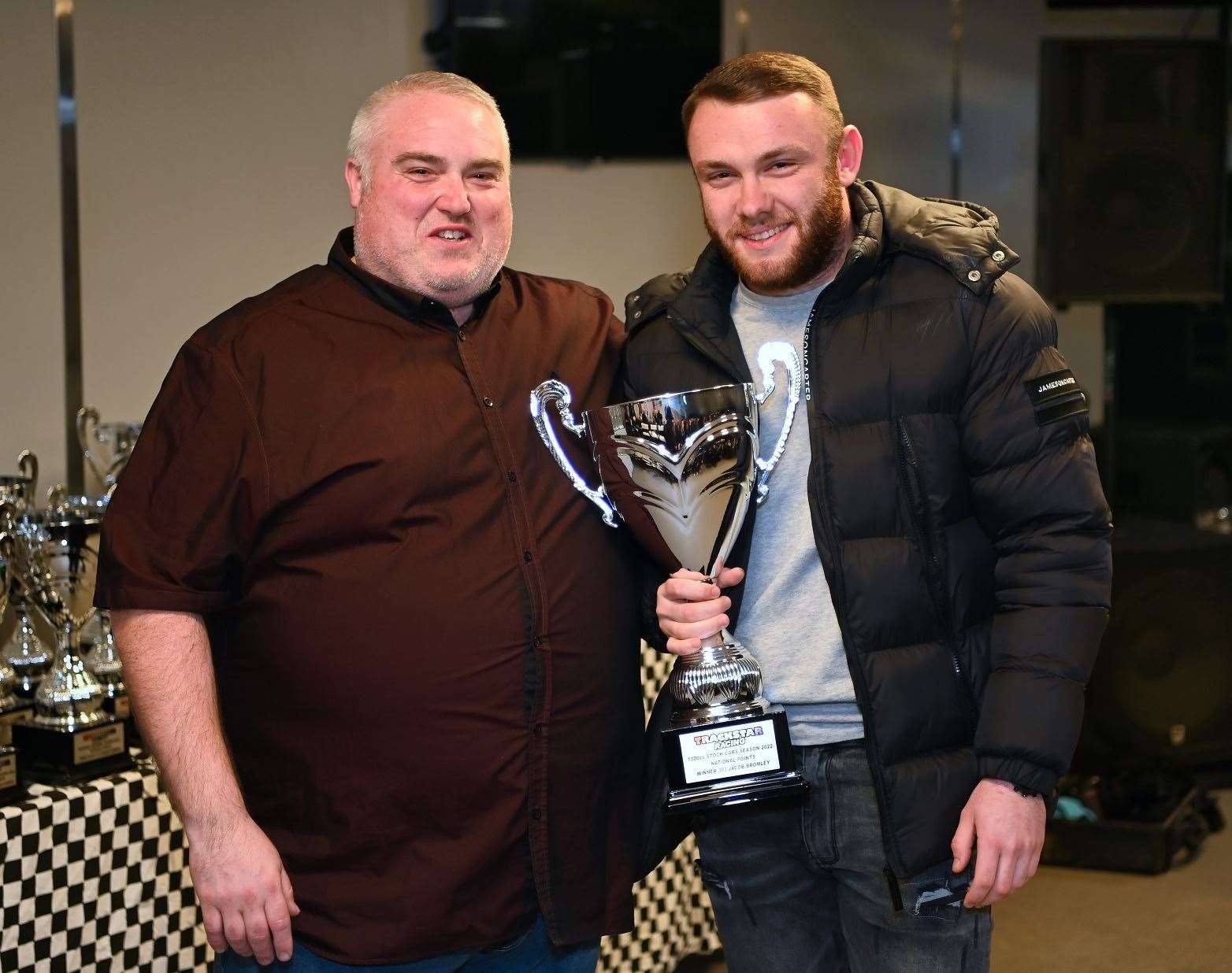 Canterbury's Jacob Bromley picks up his latest silverware with the commentator at King's Lynn, Matt Black. Picture: Jim Harrod