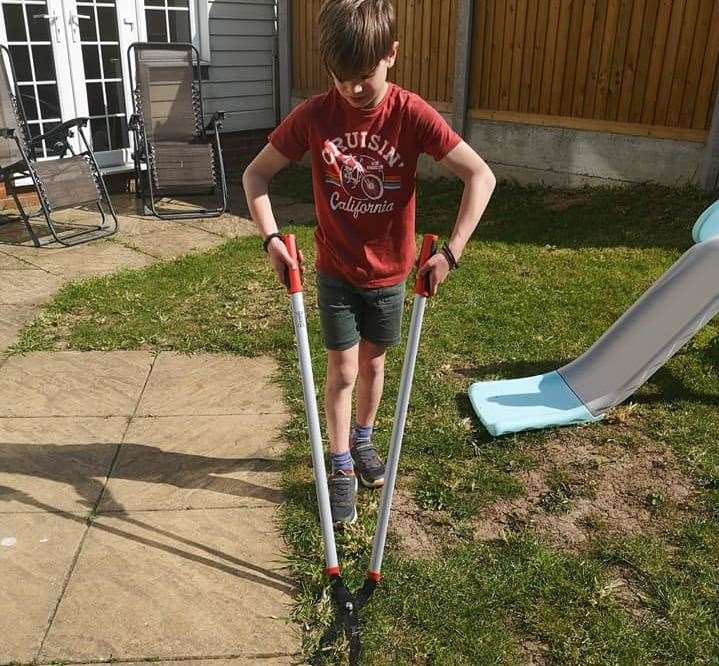 Matteo Robinson, 9, has launched his own grass-cutting business. Picture: Anthony Robinson
